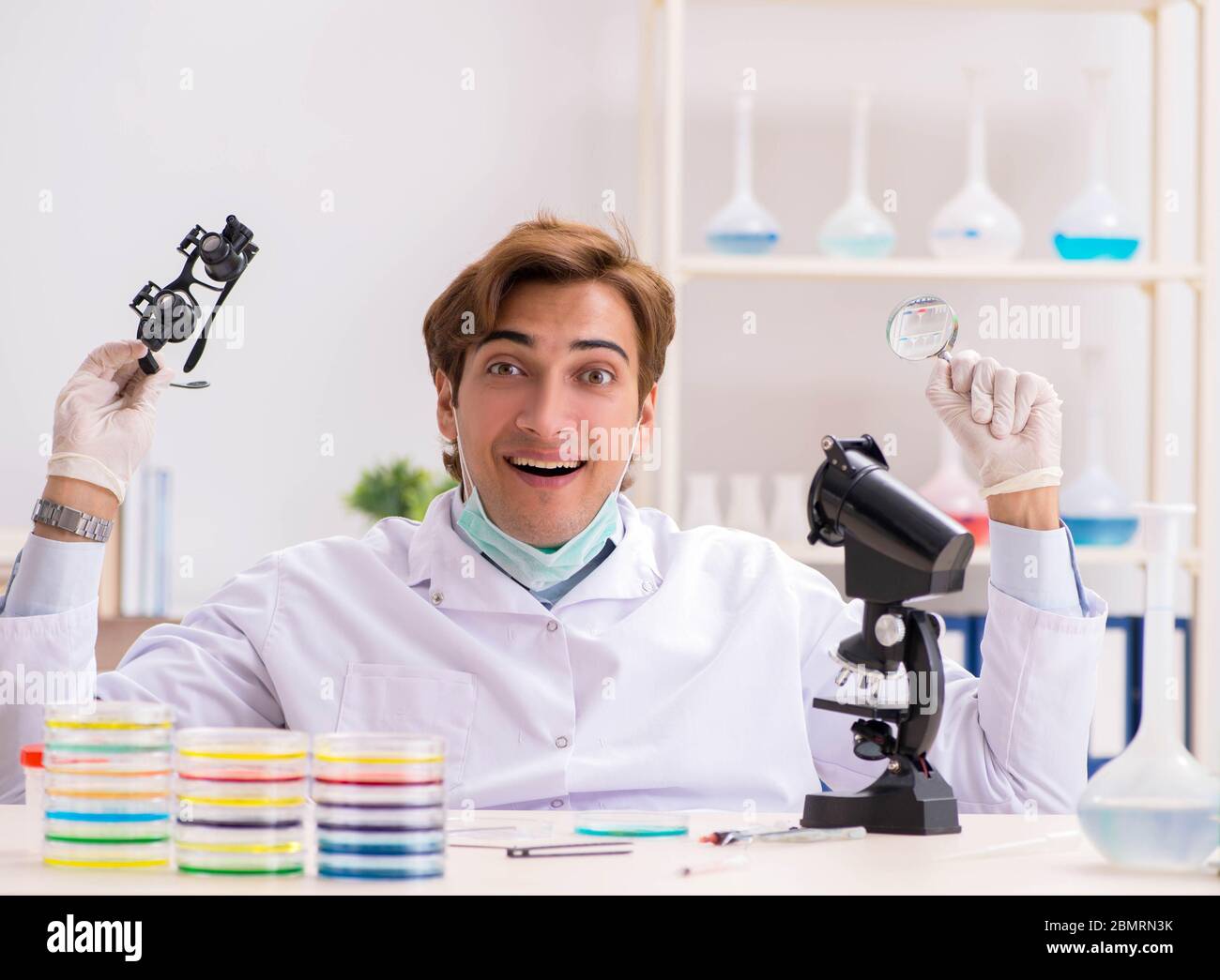 The young chemist working in the lab Stock Photo - Alamy