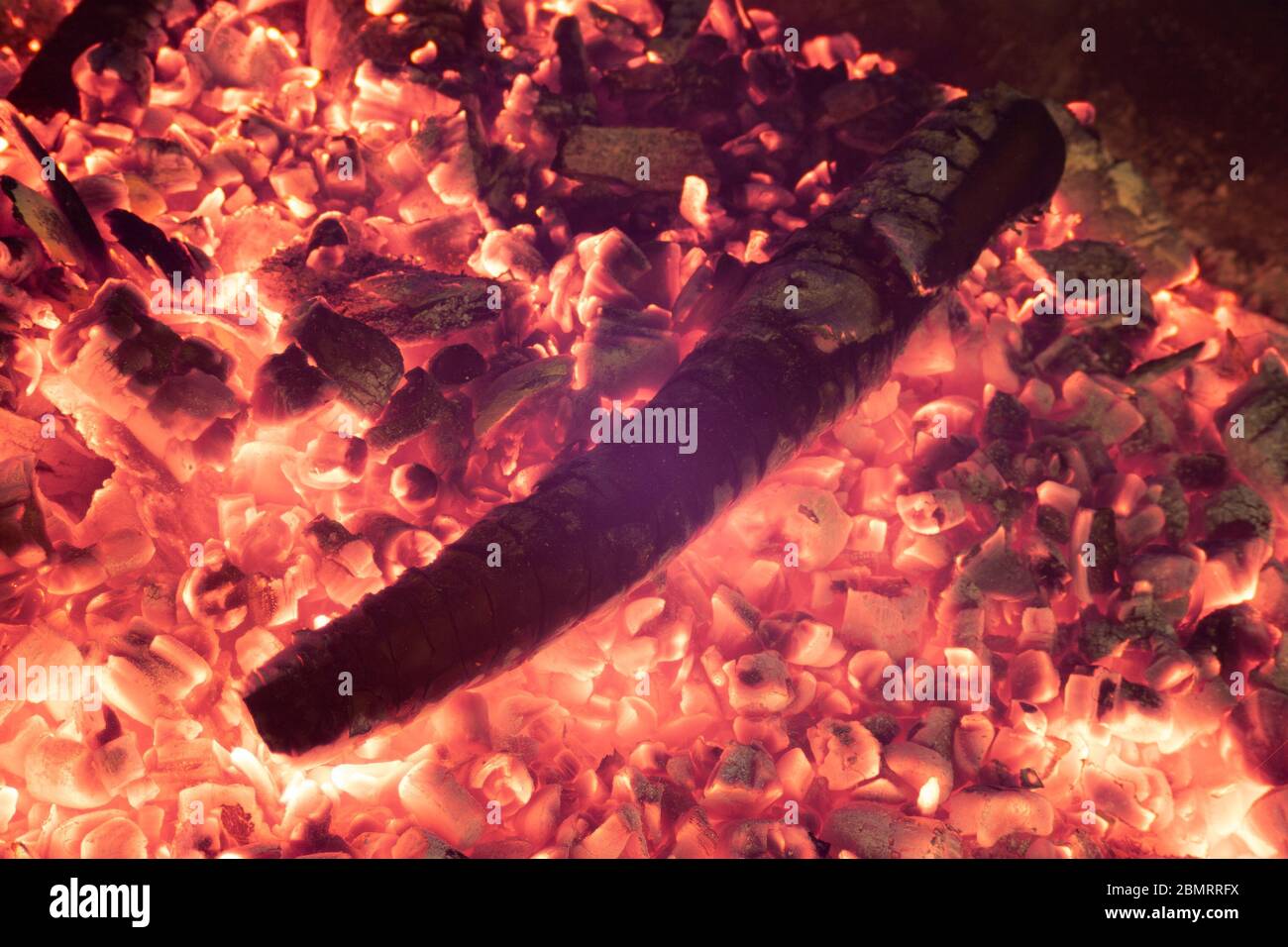 Glowing hot bonfire wood embers Stock Photo