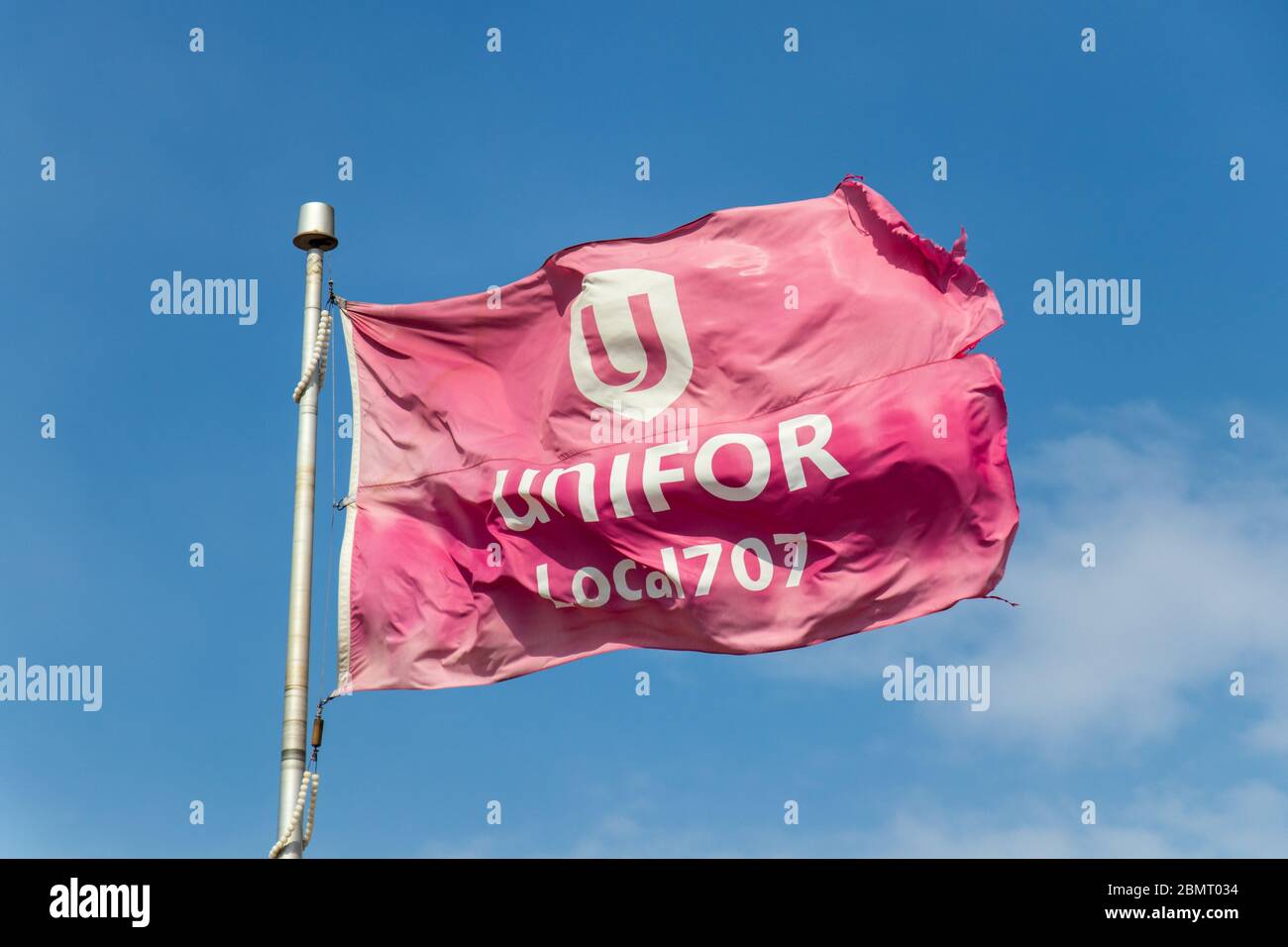 UNIFOR logo on flag at the Ford Oakville Assembly Complex, UNIFOR is general trade union in Canada and the largest private sector union in Canada. Stock Photo