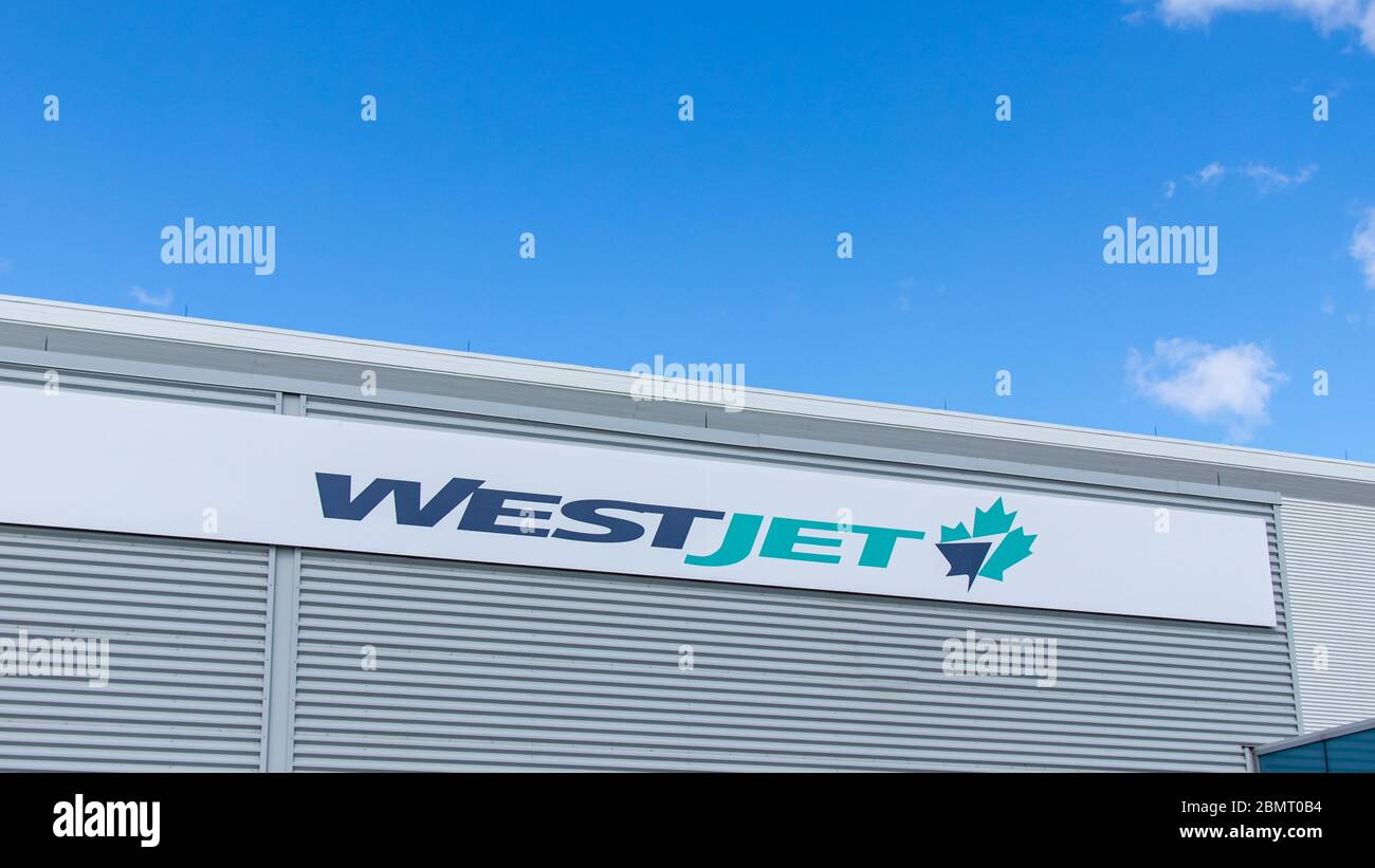 WestJet Airlines logo on their office and hanger at Toronto Pearson Intl. Airport. Stock Photo
