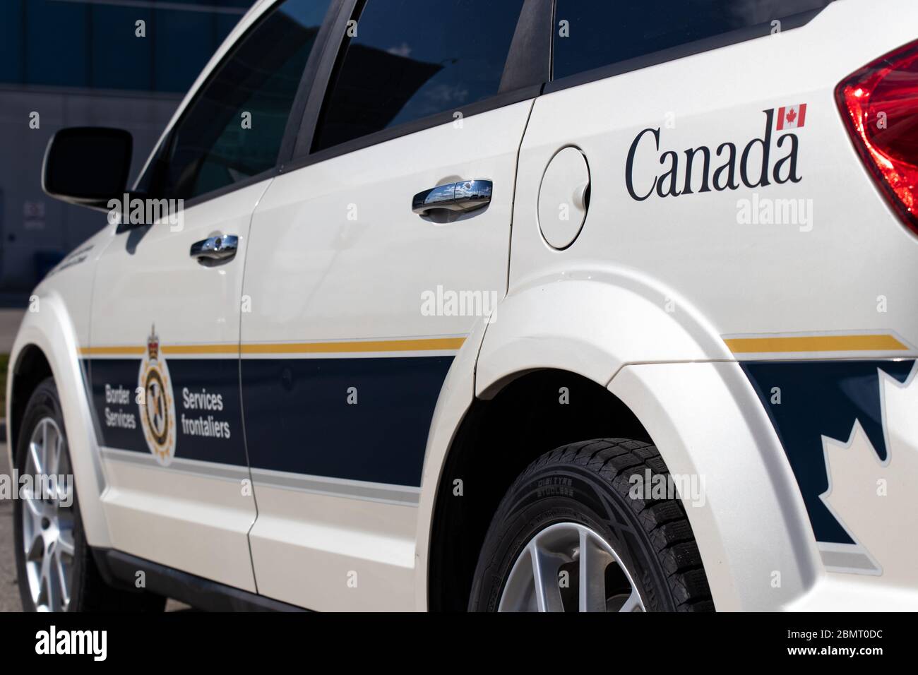 Government of Canada logo in-focus on a Canada Border Services Agency vehicle. Stock Photo
