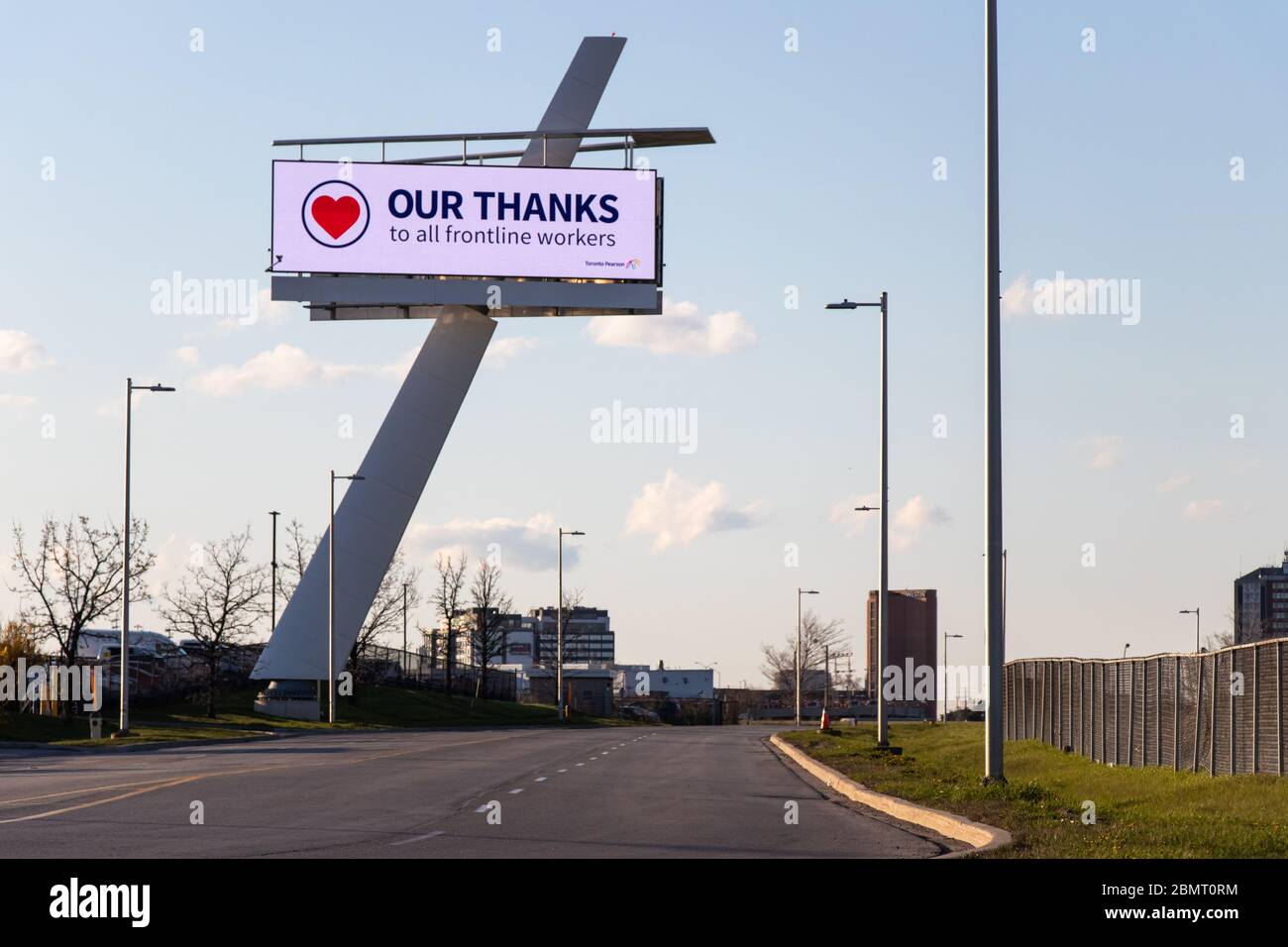 'Our Thanks To All Frontline Workers' sign near an empty Toronto Pearson Airport during the COVID-19, coronavirus pandemic. Stock Photo