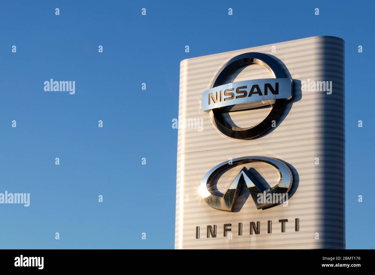 Nissan and Infiniti emblem logos on a sign at their Canadian office headquarters near Toronto. Stock Photo