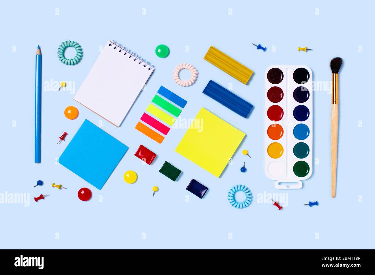 School supplies on blue background. Back to school flat lay picture ...