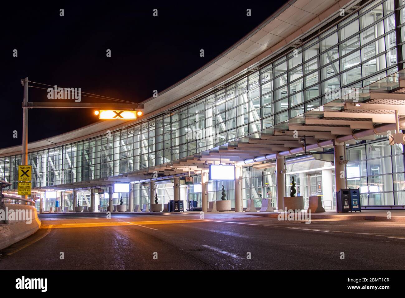 Closed entrance to Toronto Pearson, Terminal 1 at night during the global coronavirus (COVID-19) pandemic Stock Photo
