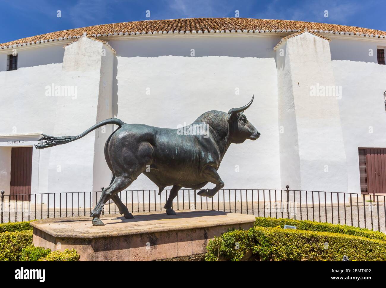 Sculpture of a bull in front of the bullring in Ronda, Spain Stock Photo