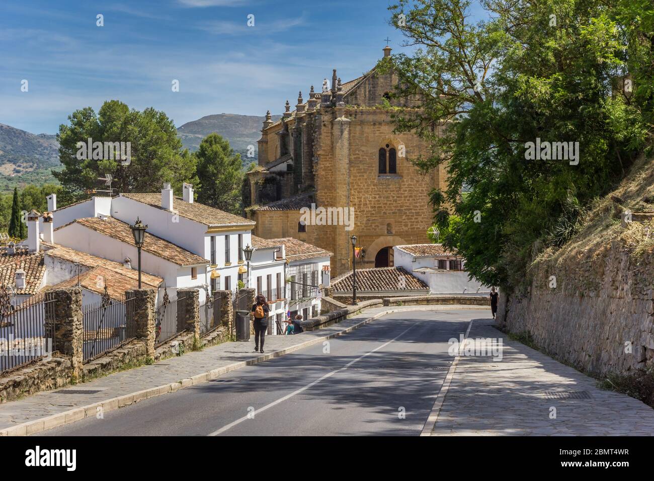 Street leading to the Espiritu Santo church in Ronda, Spain Stock Photo