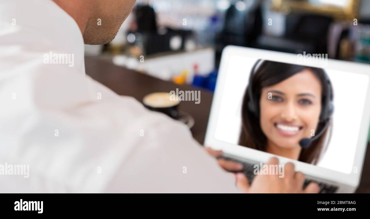 Businessman having video call with a woman on laptop Stock Photo