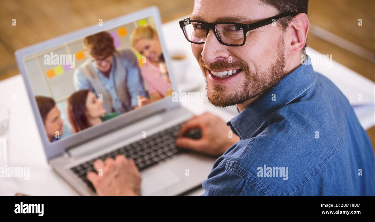 Man working and having a video call on laptop Stock Photo