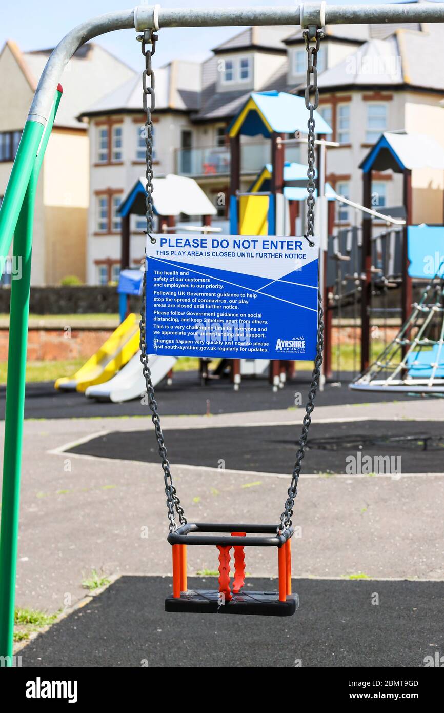 Closed off swing park because of the coronavirus pandemic, with South Ayrshire Council warning notice, Prestwick, Ayrshire, Scotland, UK Stock Photo