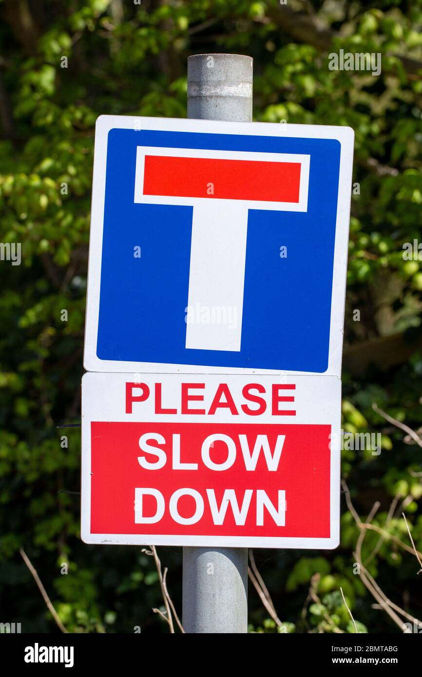 No Through Road Please Slow Down road signs, UK Stock Photo - Alamy