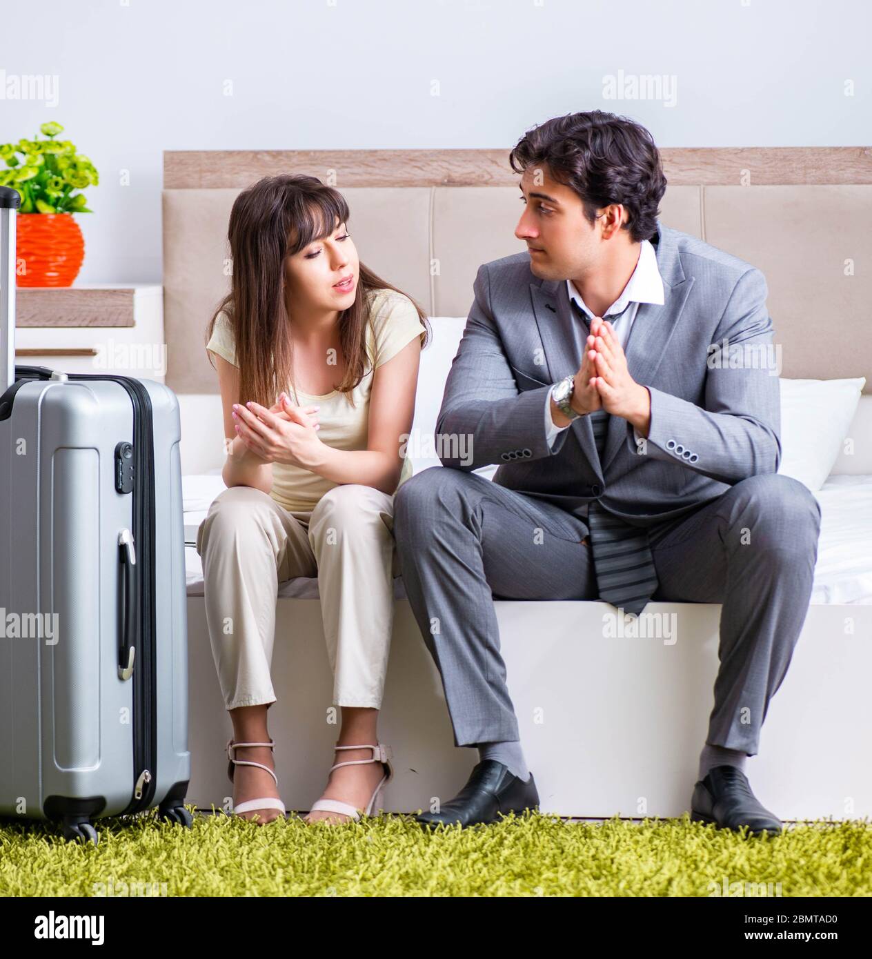 The wife seeing her husband off to business trip Stock Photo