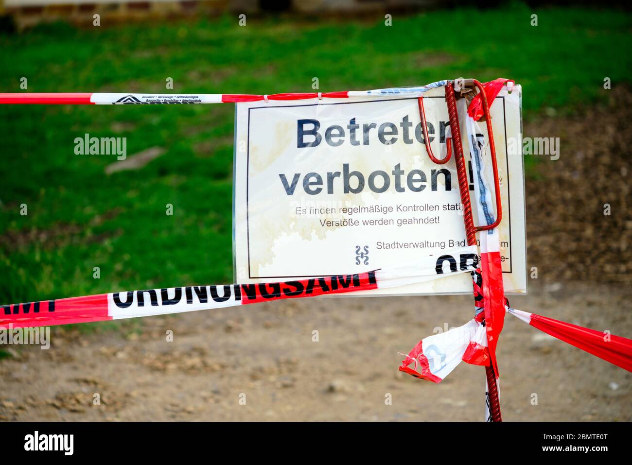 Public park closed with barrier tape in Bad Duerkheim/Germany during the lockdown to fight Covid-19 Stock Photo