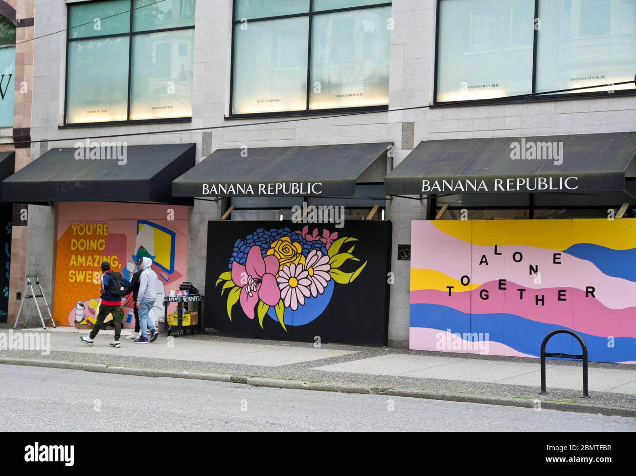 May 9, 2020: Inspiring public art on boarded up shops on Robson Street in Vancouver, Canada, during the Covid-19 pandemic. Stock Photo