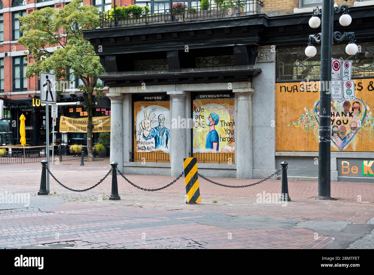 Vancouver, BC, May 9, 2020.  Boarded up shops in Gastown with painted messages of thanks to healthcare workers during the Covid 19 pandemic. Stock Photo