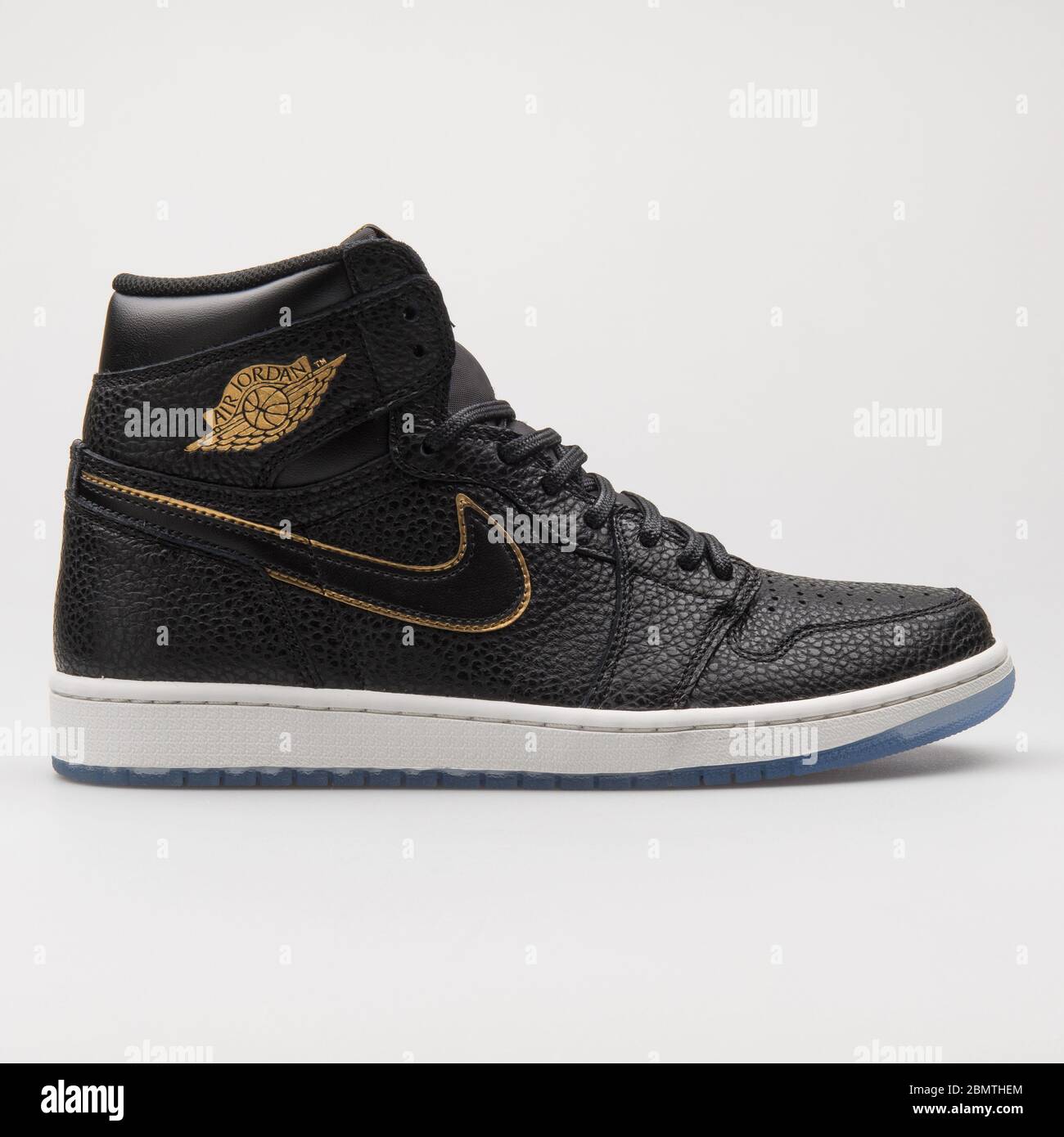 VIENNA, AUSTRIA - JANUARY 12, 2018: Nike Air Jordan 1 Retro High OG black  and metallic gold sneaker on white background Stock Photo - Alamy