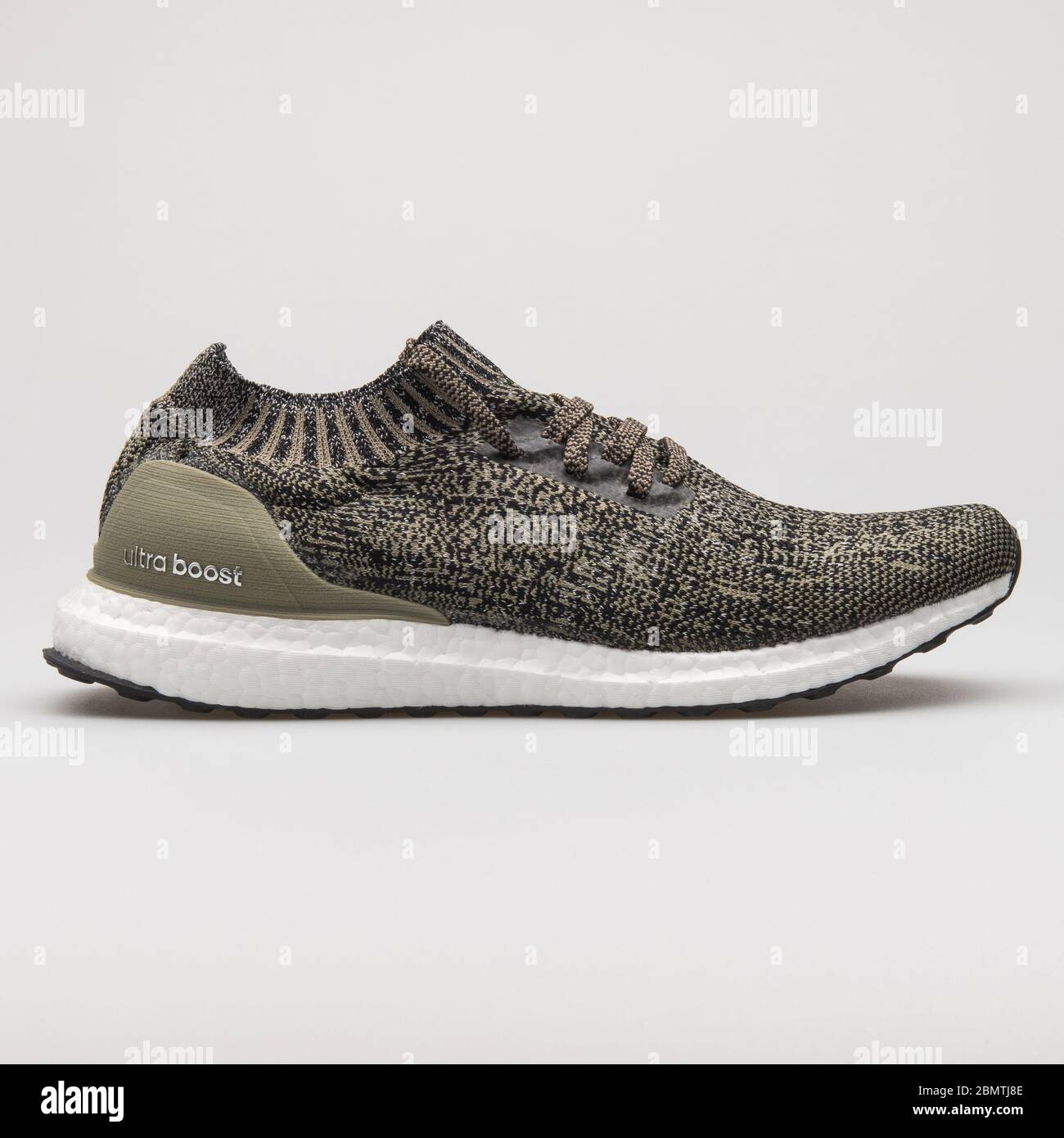 VIENNA, AUSTRIA - FEBRUARY 14, 2018: Adidas UltraBoost Uncaged olive green  and black sneaker on white background Stock Photo - Alamy