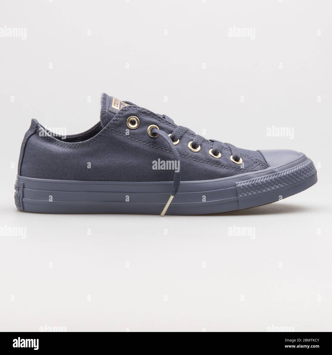 VIENNA, AUSTRIA - FEBRUARY 19, 2018: Converse Chuck Taylor All Star OX  light carbon and gold sneaker on white background Stock Photo - Alamy