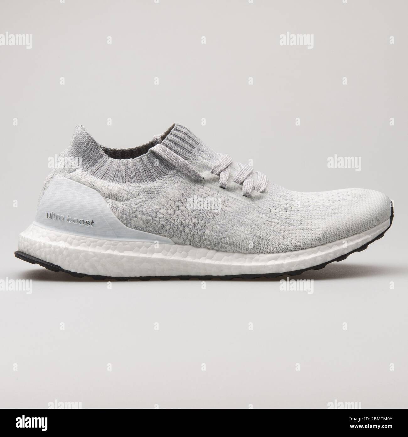 VIENNA, AUSTRIA - FEBRUARY 19, 2018: Adidas Ultra Boost Uncaged grey and  white sneaker on white background Stock Photo - Alamy