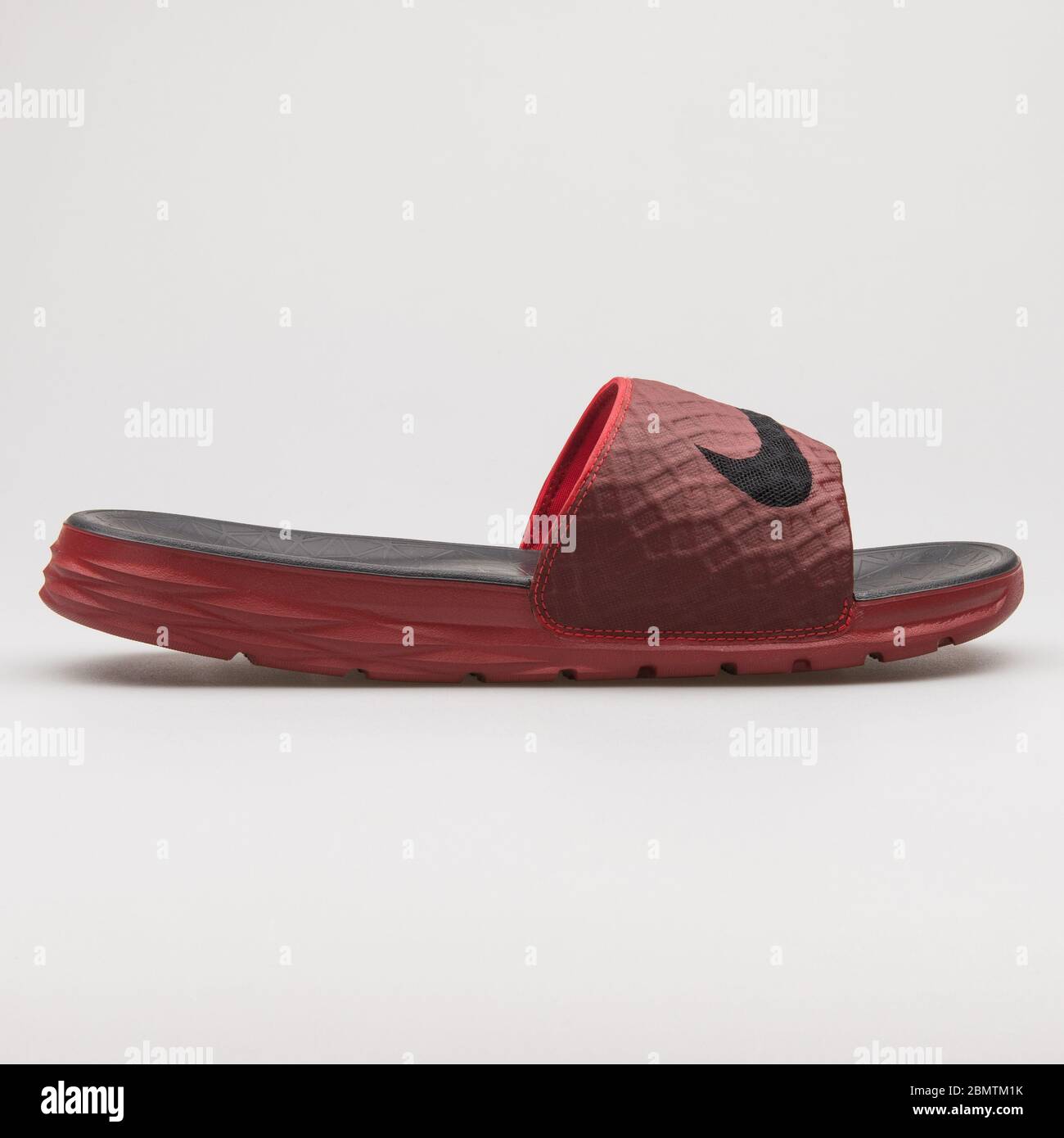 VIENNA, AUSTRIA - FEBRUARY 19, 2018: Nike Benassi Solarsoft red and black  sandal on white background Stock Photo - Alamy