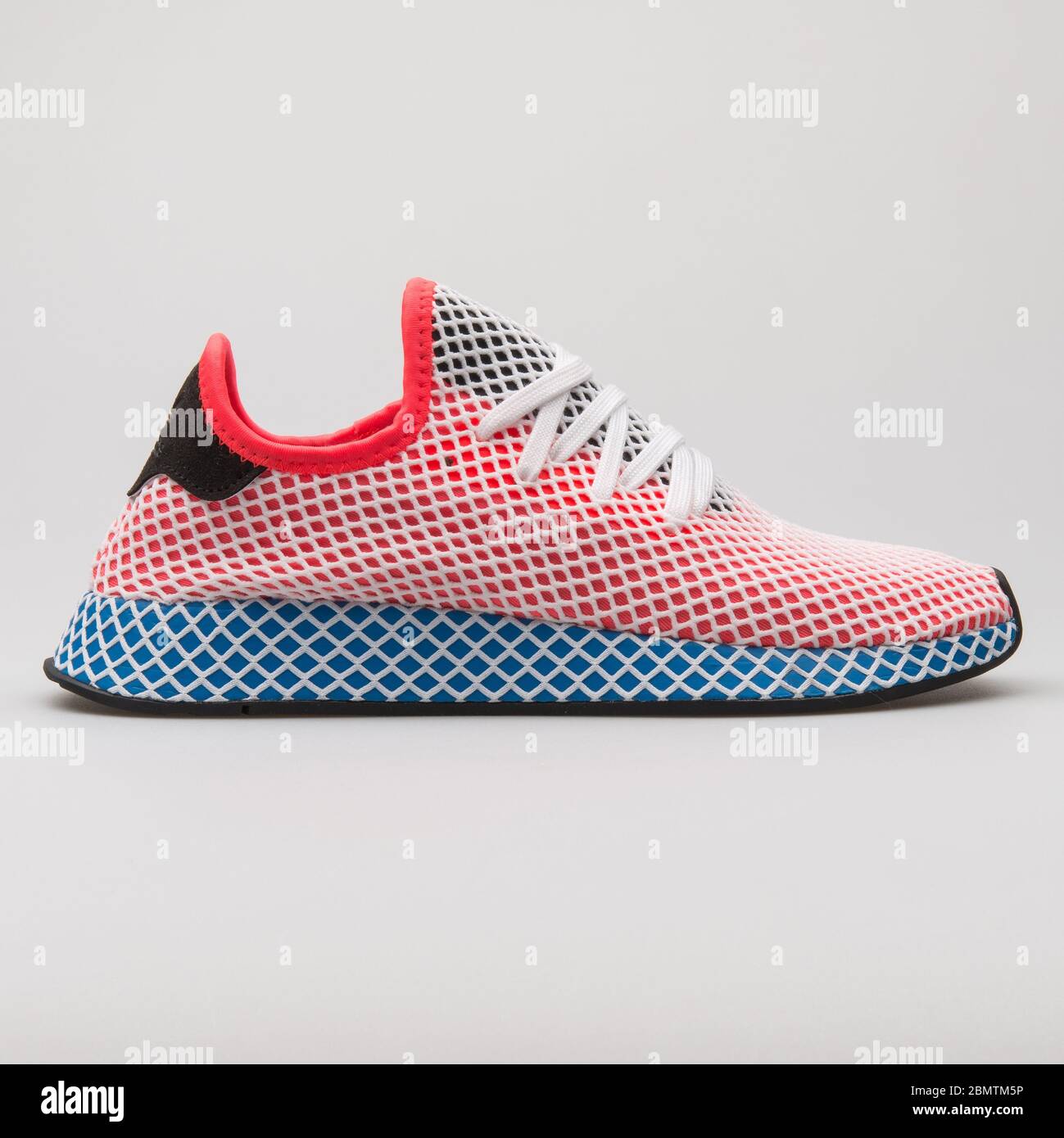 VIENNA, AUSTRIA - FEBRUARY 19, 2018: Adidas Deerupt Runner red, blue and  white sneaker on white background Stock Photo - Alamy
