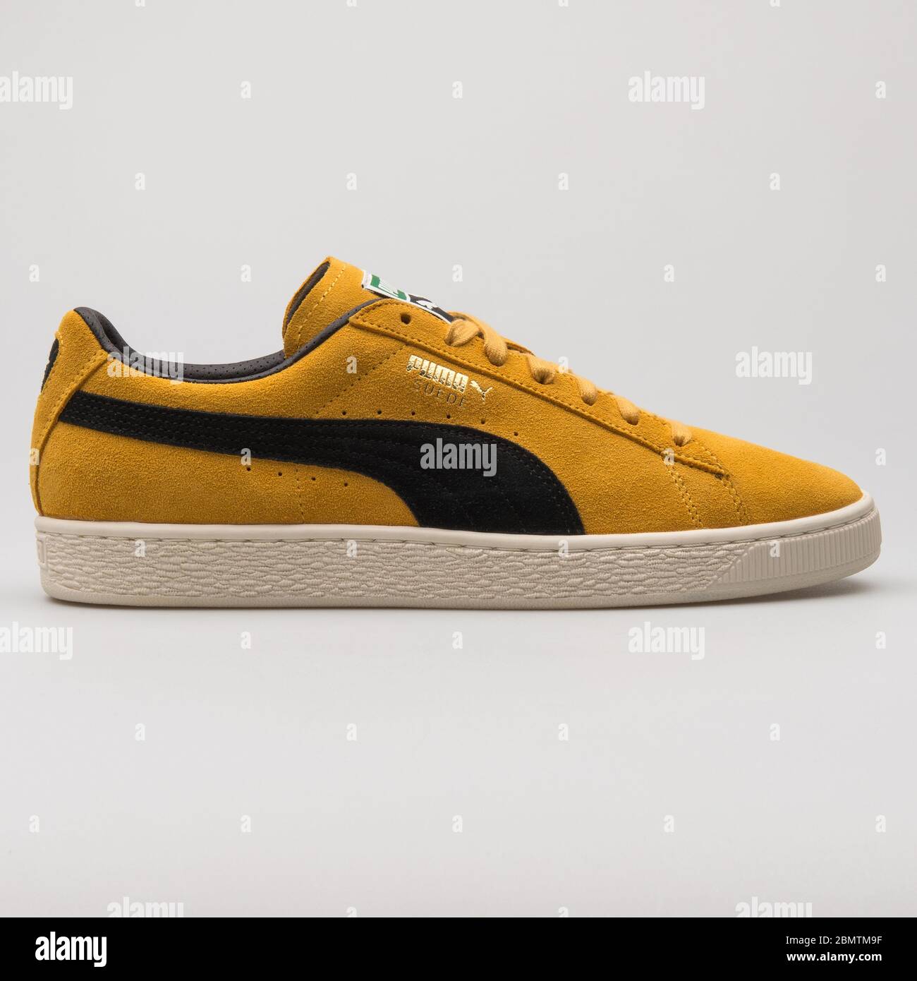VIENNA, AUSTRIA - FEBRUARY 19, 2018: Puma Suede Classic Archive yellow and  black sneaker on white background Stock Photo - Alamy