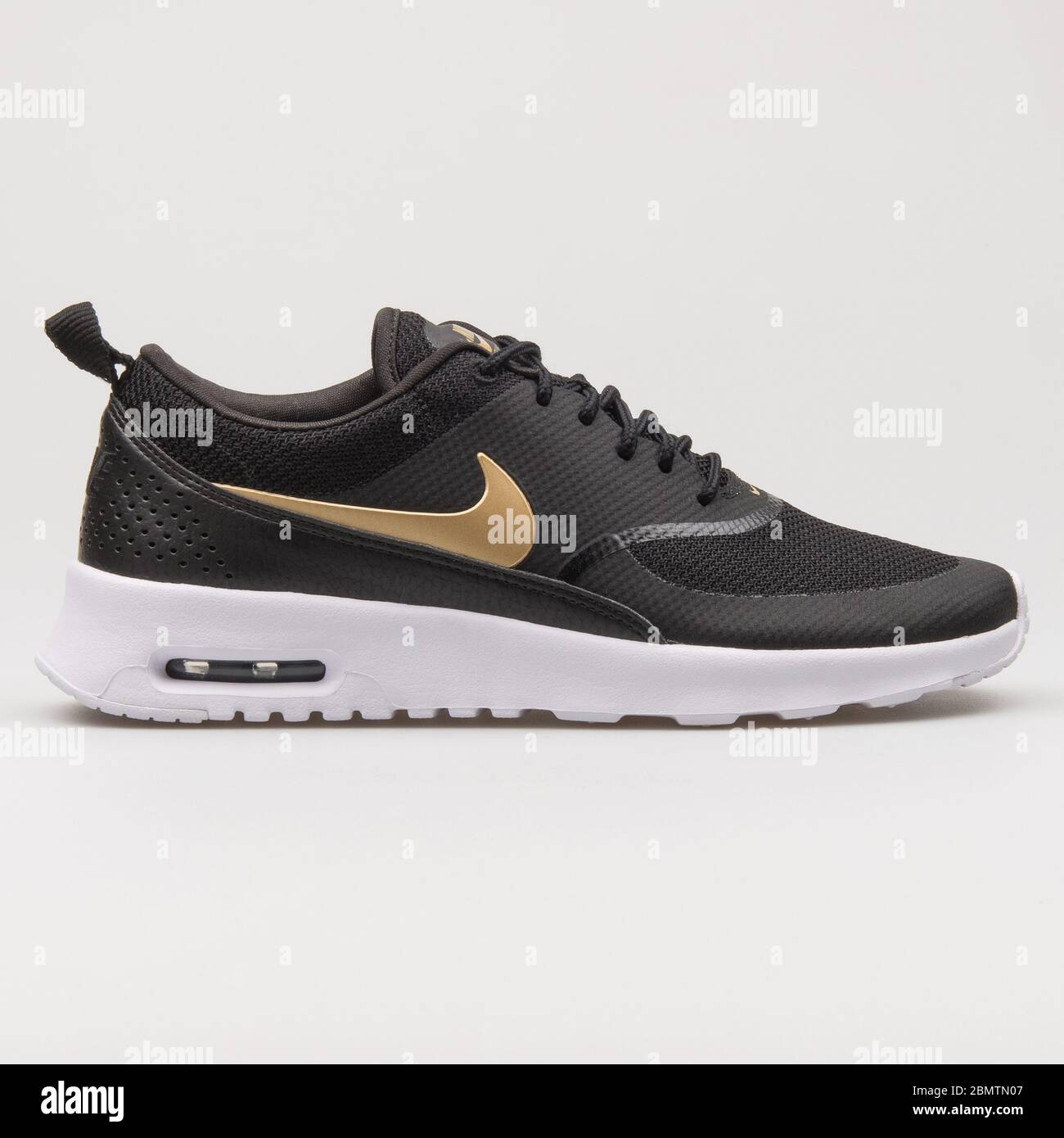 nike air max thea trainers in white and gold