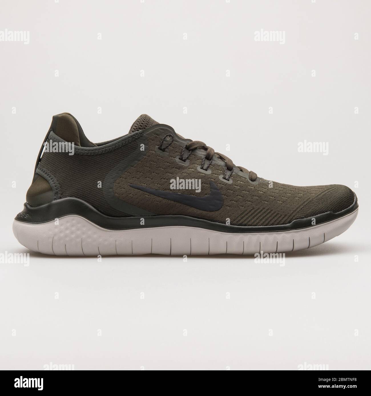 VIENNA, AUSTRIA - FEBRUARY 19, 2018: Nike Free RN 2018 cargo khaki sneaker  on white background Stock Photo - Alamy