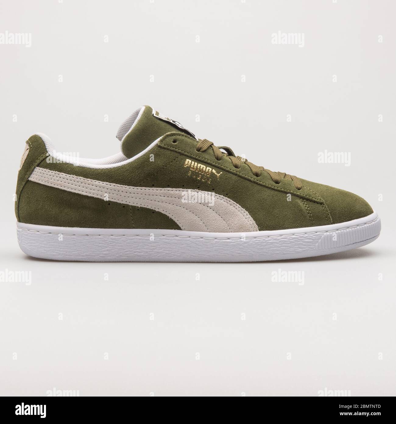 VIENNA, AUSTRIA - FEBRUARY 19, 2018: Puma Suede Classic olive green and  white sneaker on white background Stock Photo - Alamy