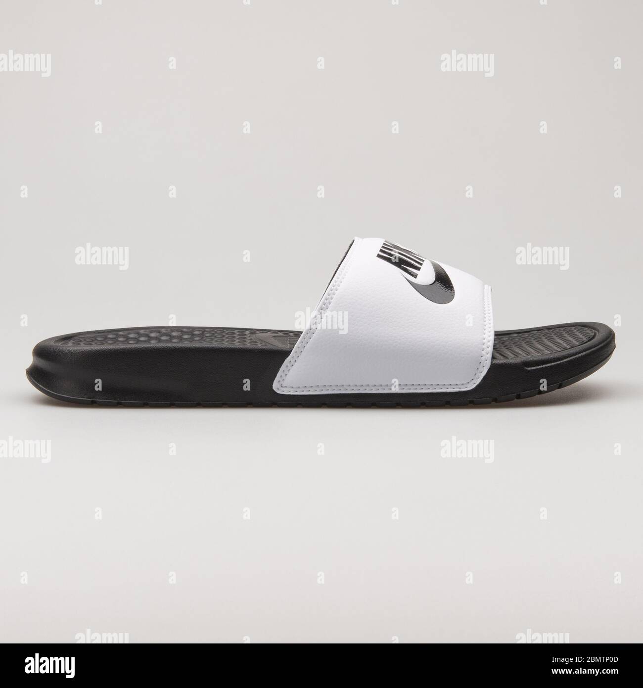 VIENNA, AUSTRIA - FEBRUARY 19, 2018: Nike Benassi JDI black and white  sandal on white background Stock Photo - Alamy