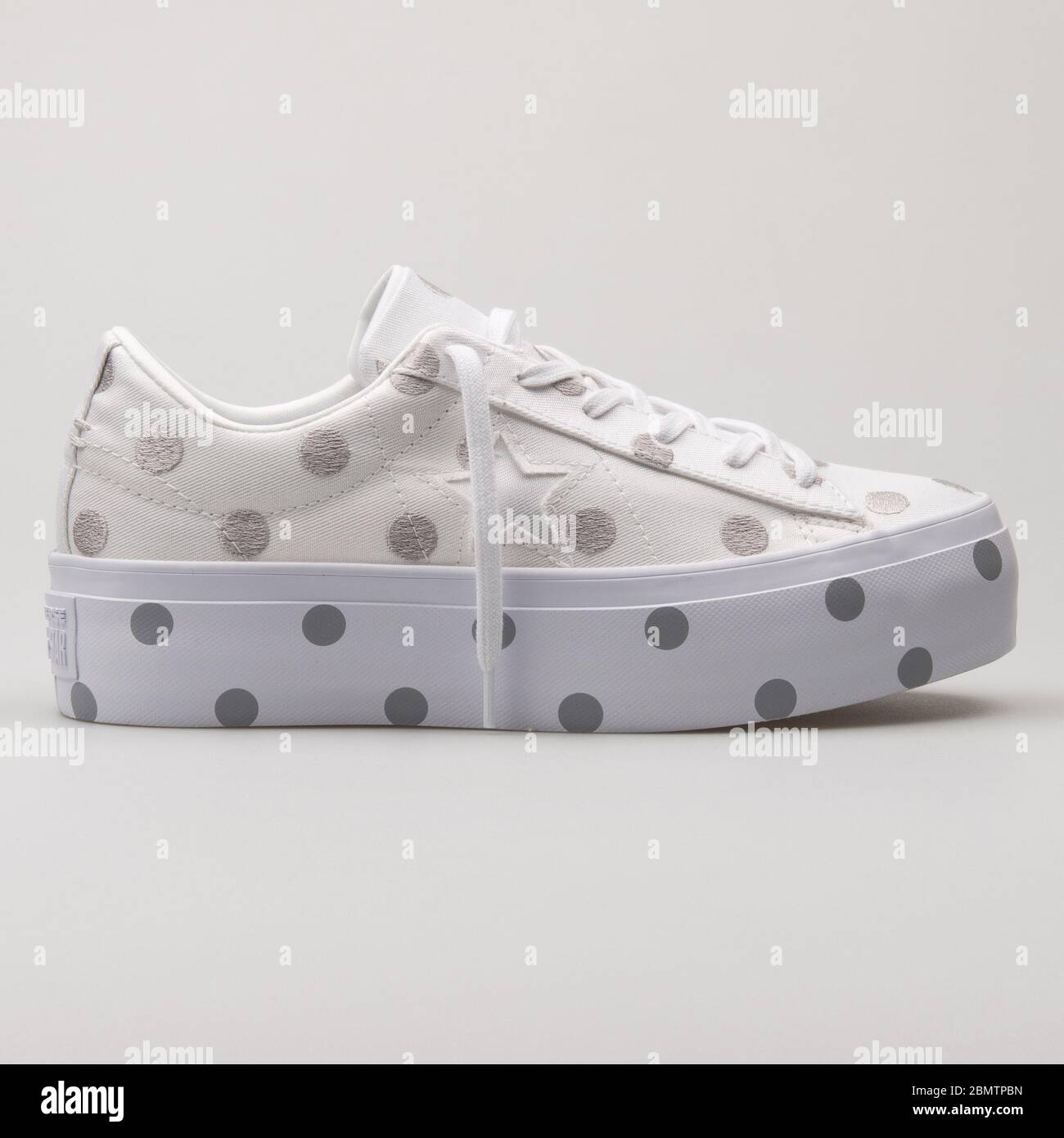 VIENNA, AUSTRIA - FEBRUARY 19, 2018: Converse Chuck Taylor All Star Platform OX white and grey sneaker on white background. Stock Photo