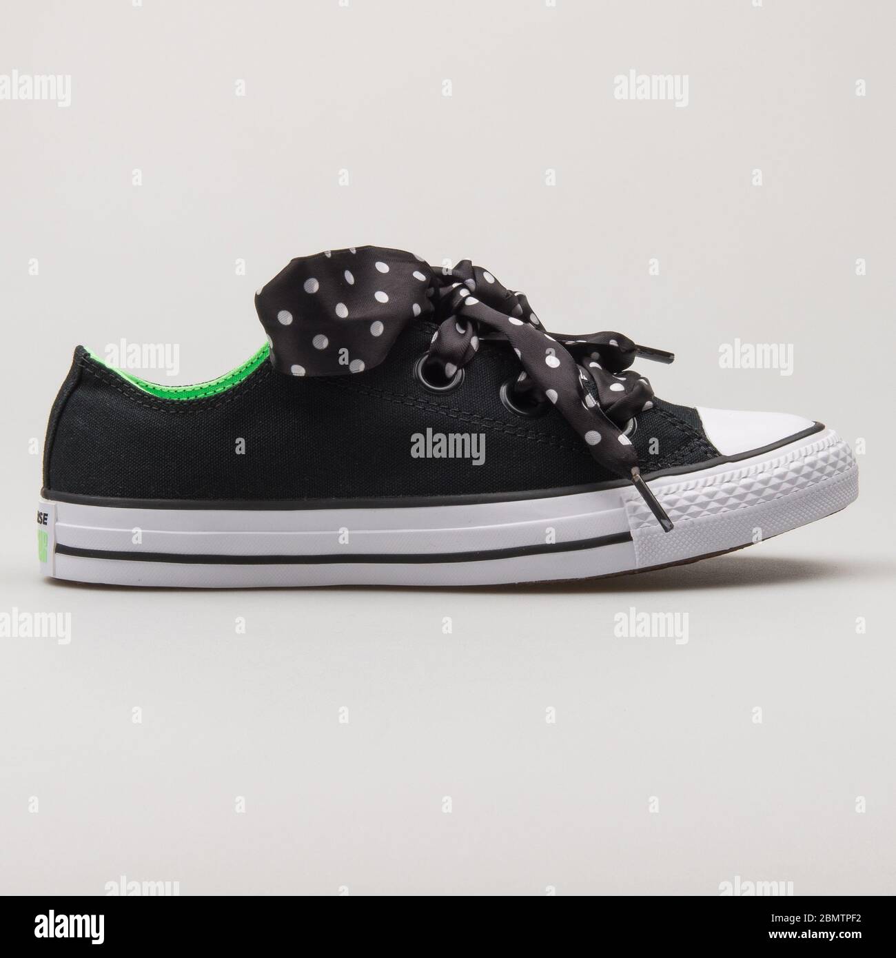 VIENNA, AUSTRIA - FEBRUARY 19, 2018: Converse Chuck Taylor All Star Big Eyelets OX black, green and white sneaker on white background. Stock Photo
