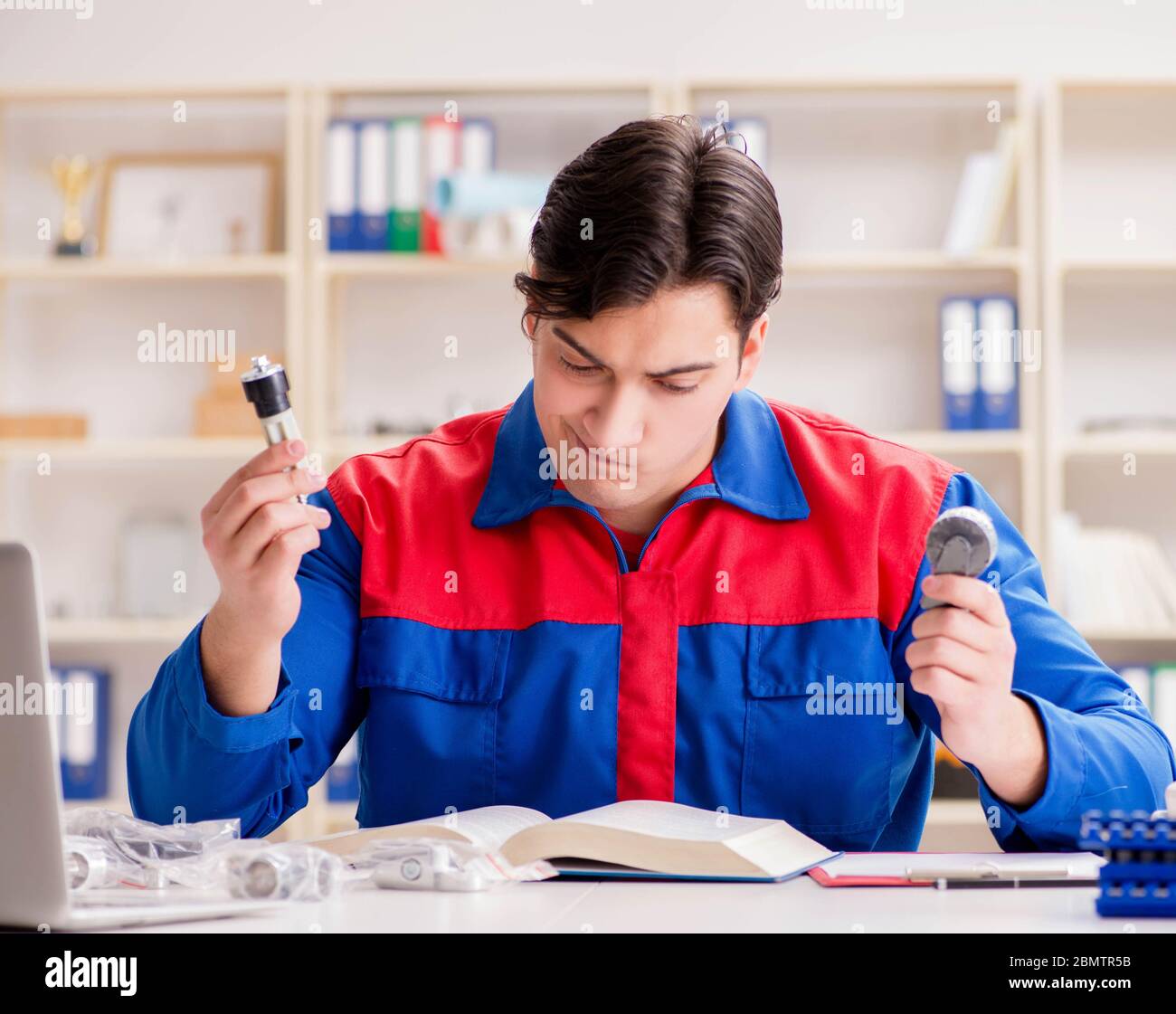 The worker in uniform working on project Stock Photo