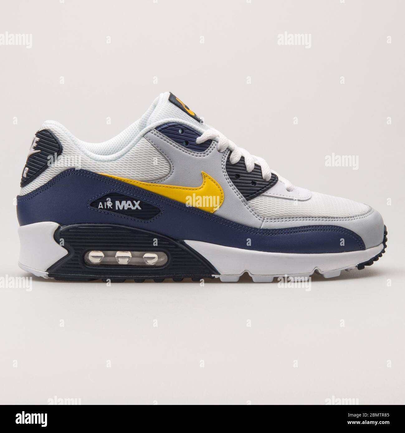 VIENNA, AUSTRIA - MAY 27, 2018: Nike Air Max 90 Essential white, yellow,  blue and black sneaker on white background Stock Photo - Alamy