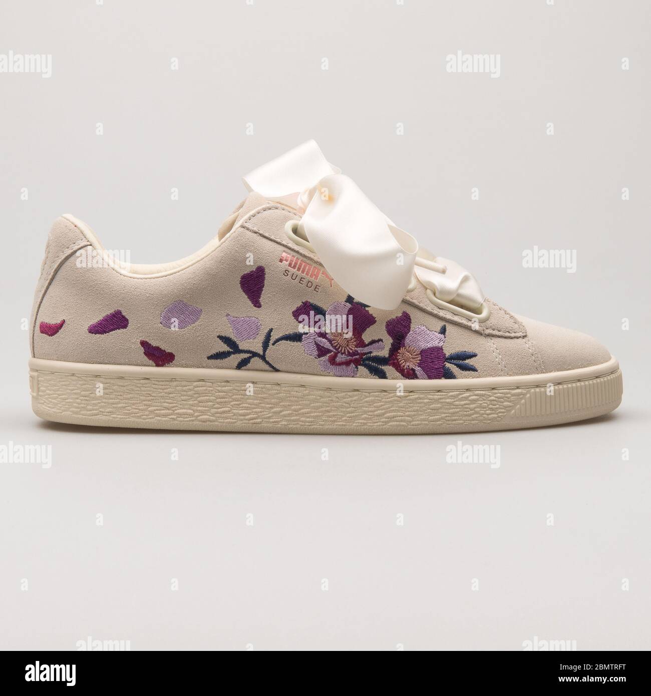 VIENNA, AUSTRIA - MAY 27, 2018: Puma Suede Heart Flowery beige, purple and  rose gold sneaker on white background Stock Photo - Alamy