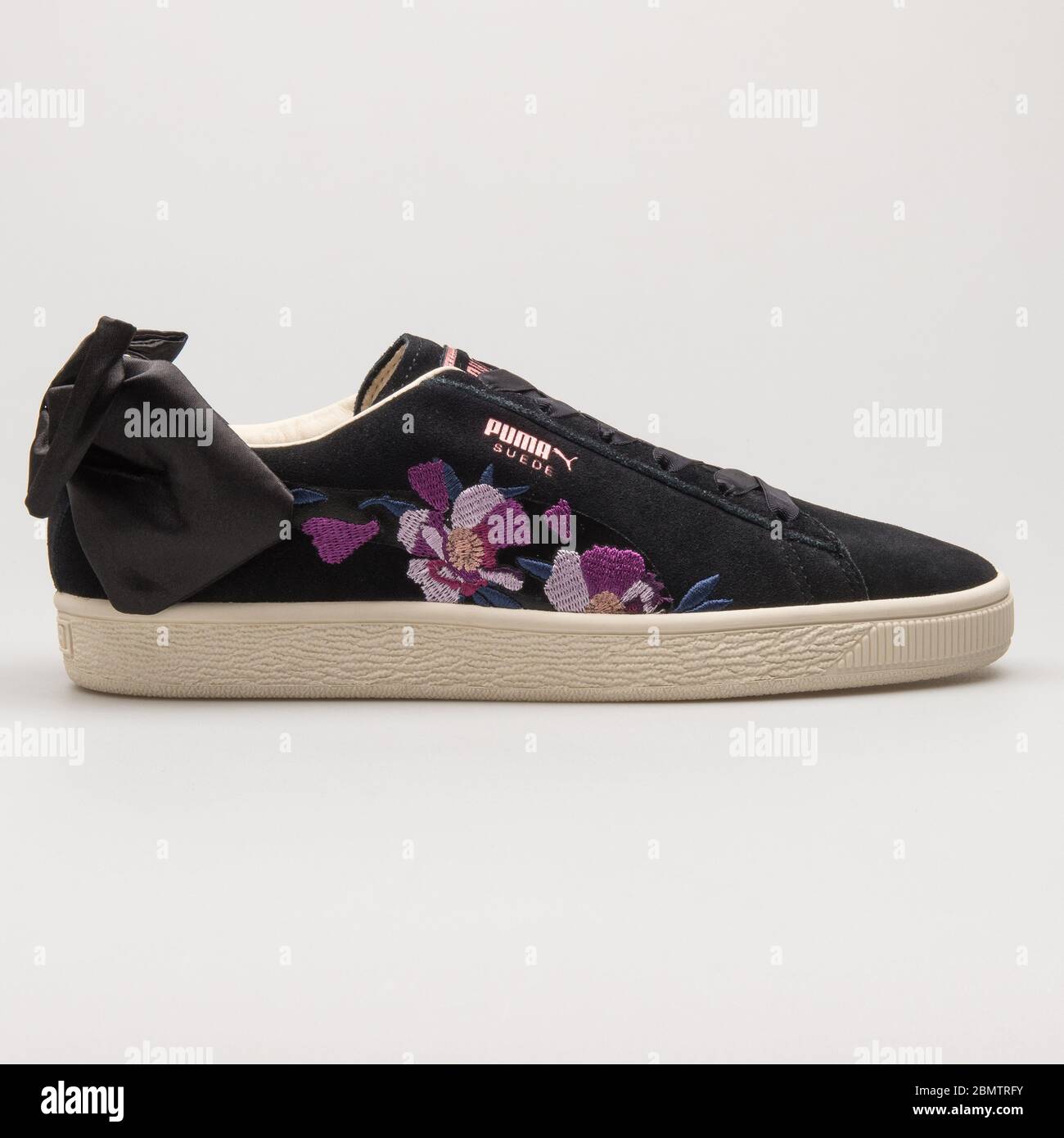 VIENNA, AUSTRIA - MAY 27, 2018: Puma Suede Bow Flowery black, rose gold and  purple sneaker on white background Stock Photo - Alamy