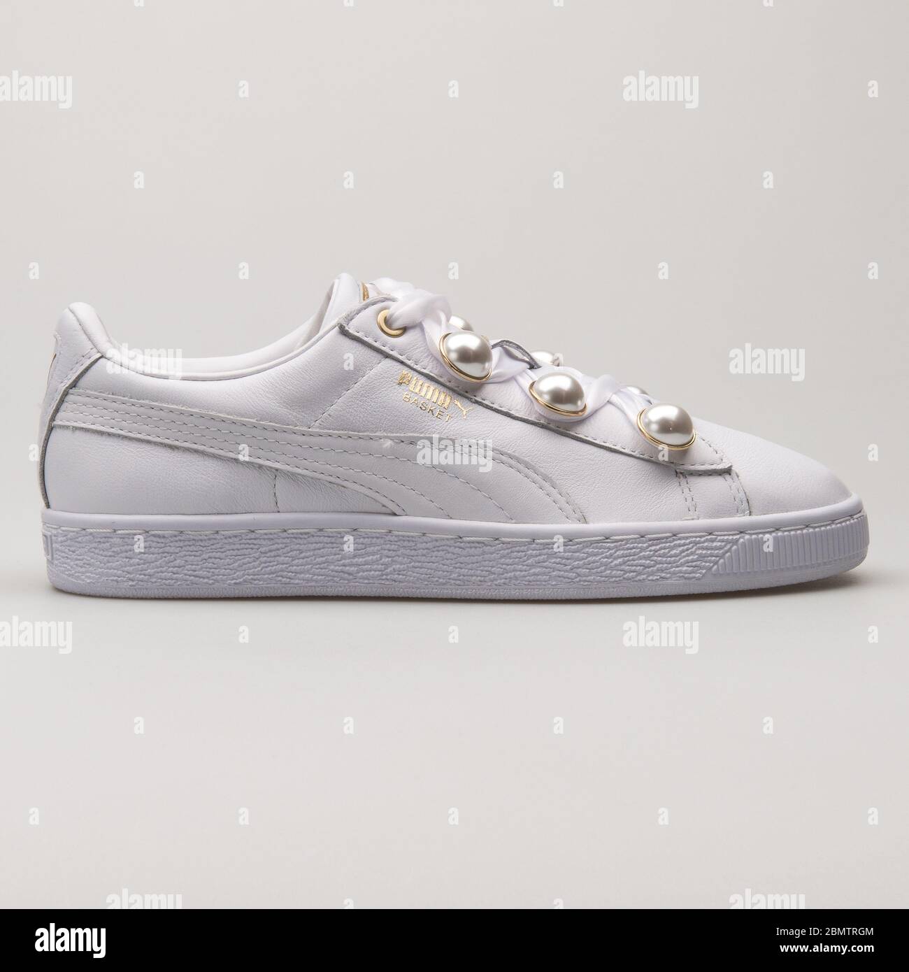 VIENNA, AUSTRIA - MAY 27, 2018: Puma Basket Bling white and gold sneaker on  white background Stock Photo - Alamy