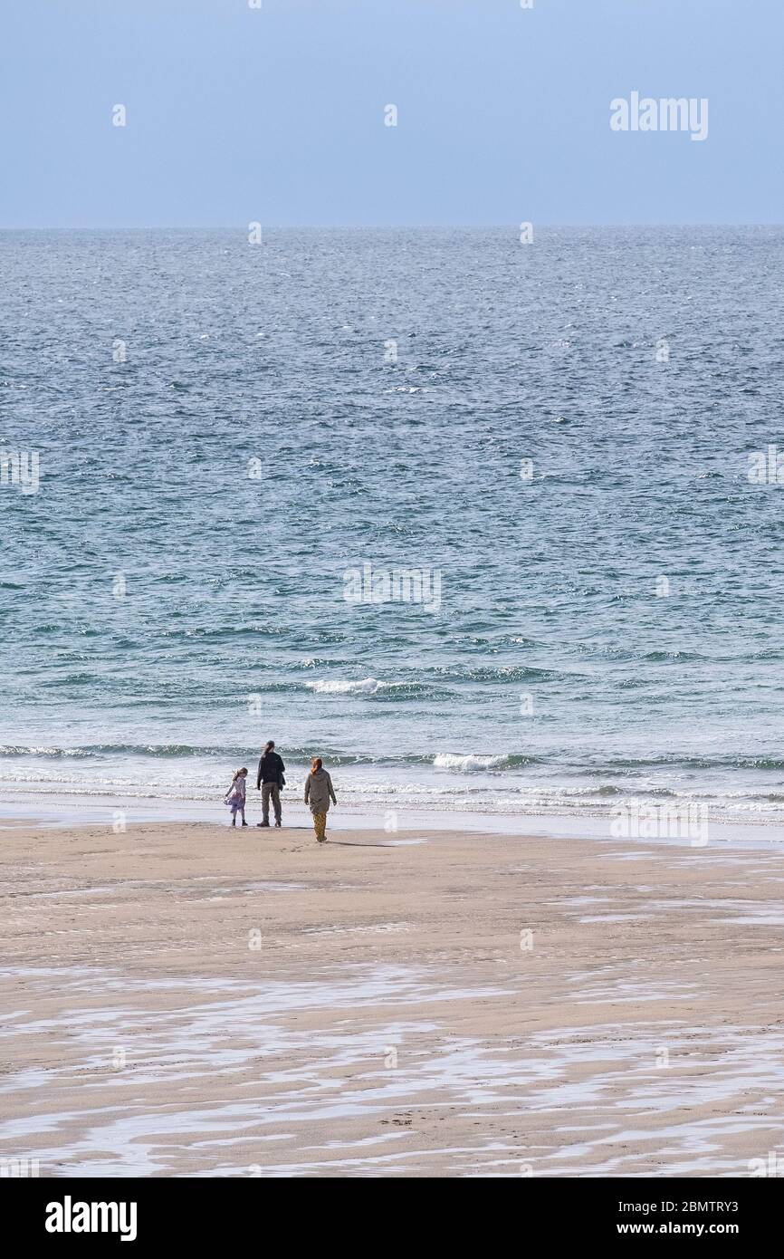 Due to the Coronavirus Covid 19 pandemic the normally busy Fistral Beach is now virtually empty in Newquay in Cornwall. Stock Photo