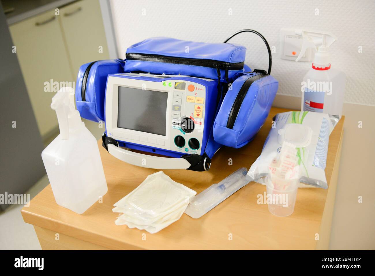 Automated External Defibrillator on display. It is a portable