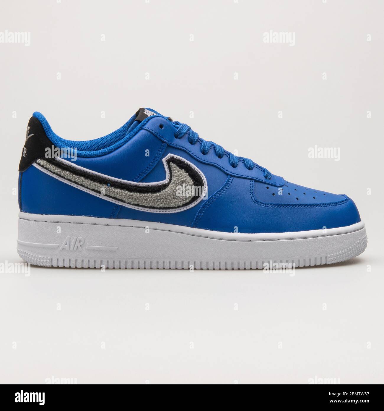 VIENNA, AUSTRIA - JUNE 14, 2018: Nike Air Force 1 07 LV8 blue, grey, black and white sneaker on white background. Stock Photo