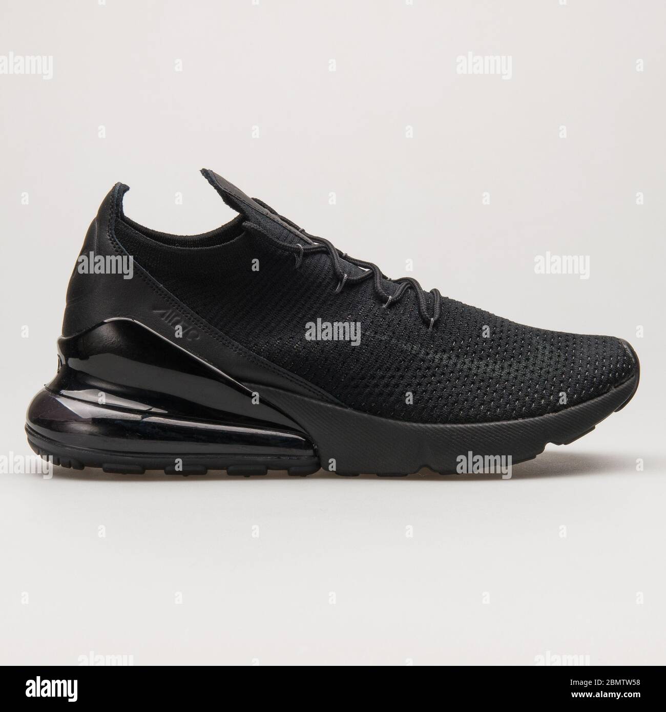 VIENNA, AUSTRIA - JUNE 14, 2018: Nike Air Max 270 Flyknit black sneaker on white background. Stock Photo