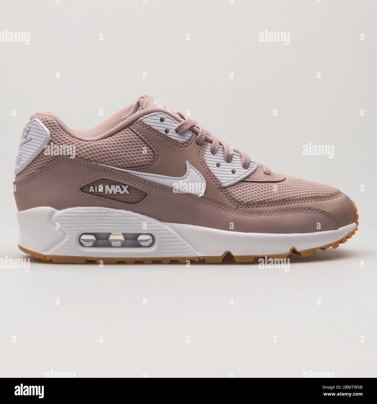 VIENNA, AUSTRIA - JUNE 14, 2018: Nike Air Max 90 taupe and white sneaker on white background. Stock Photo