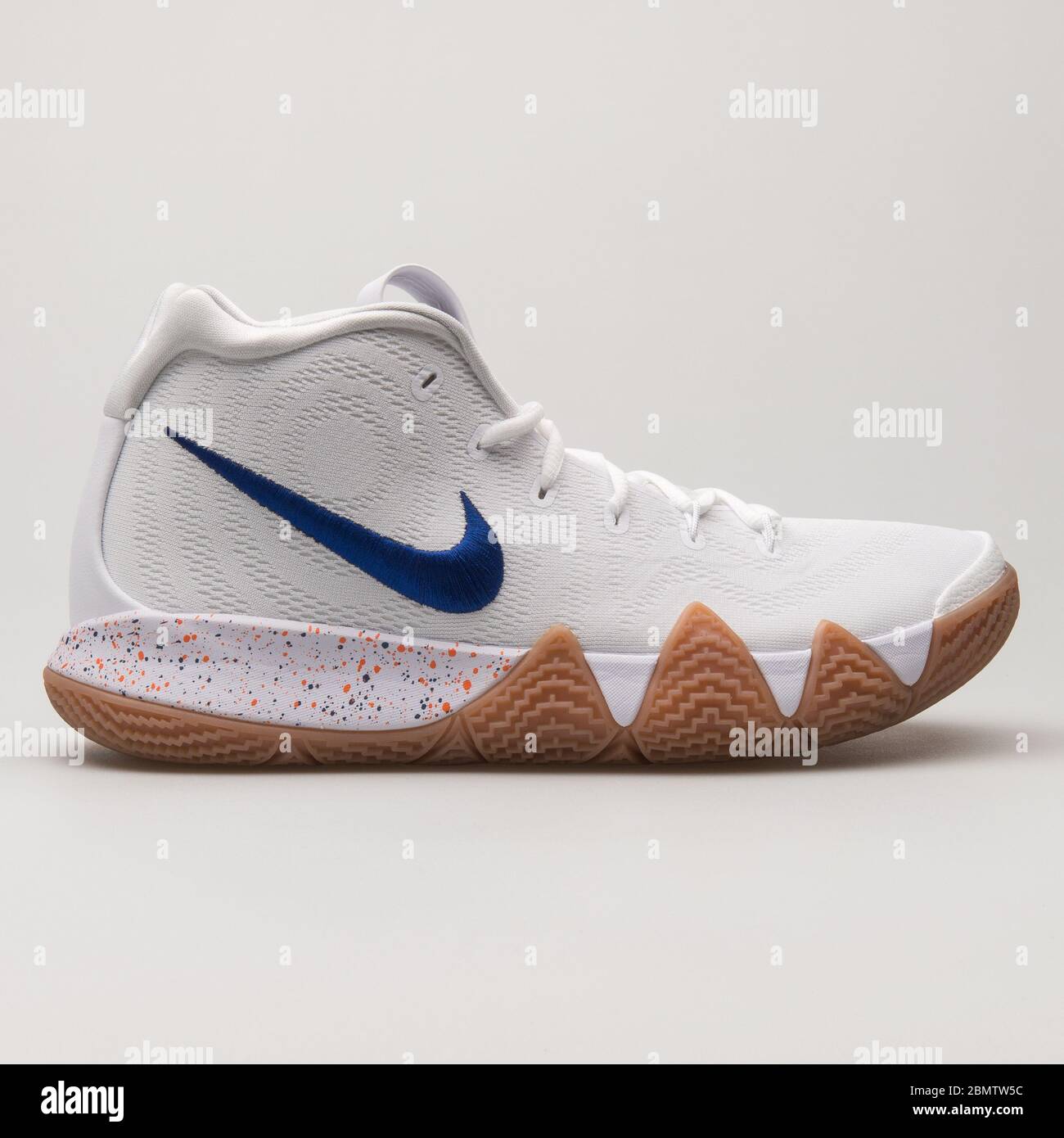 VIENNA, AUSTRIA - JUNE 14, 2018: Nike Kyrie 4 white, blue and brown sneaker on white background. Stock Photo