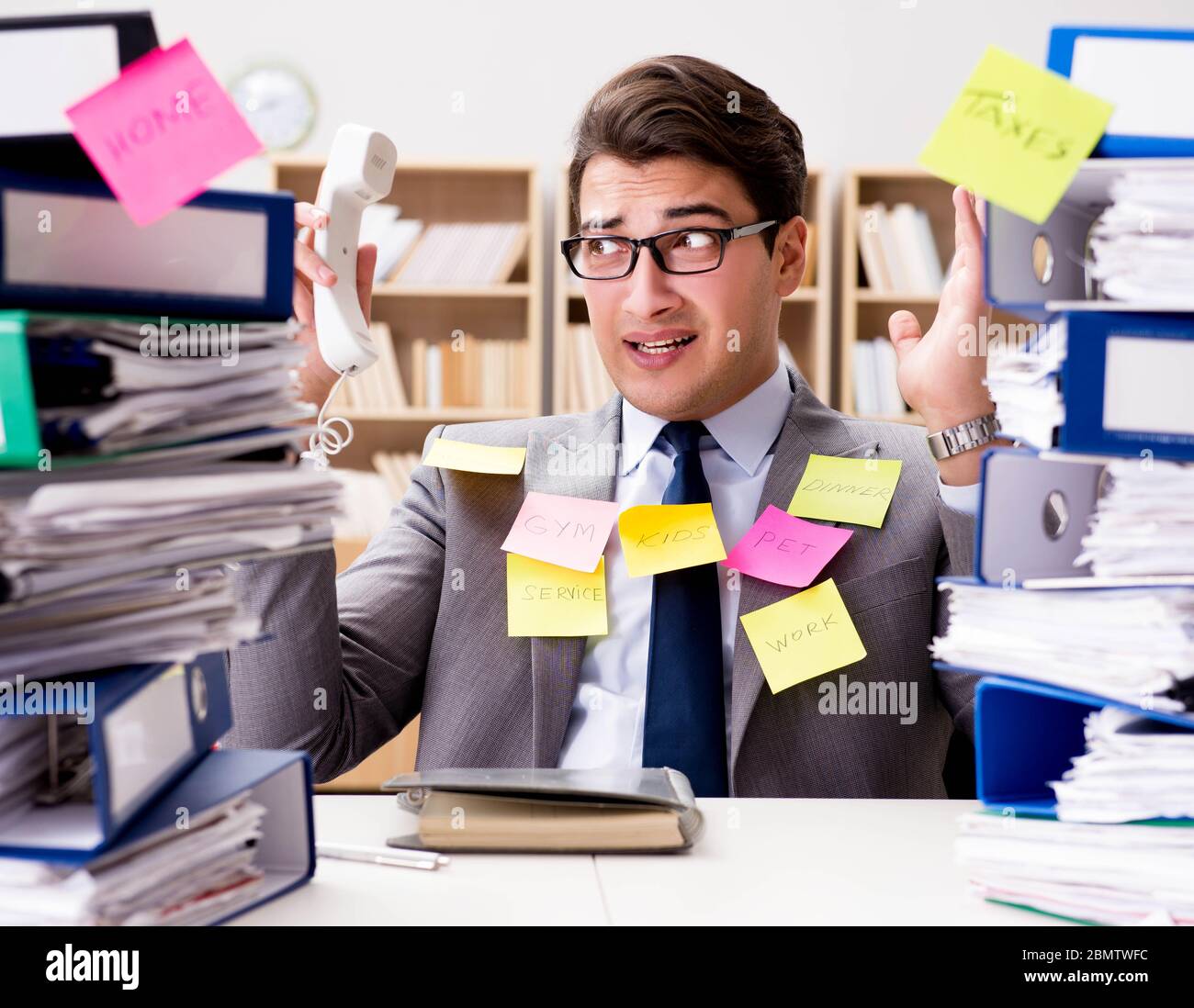 Multiple Priorities Image The businessman struggling with multiple priorities Stock Photo - Alamy