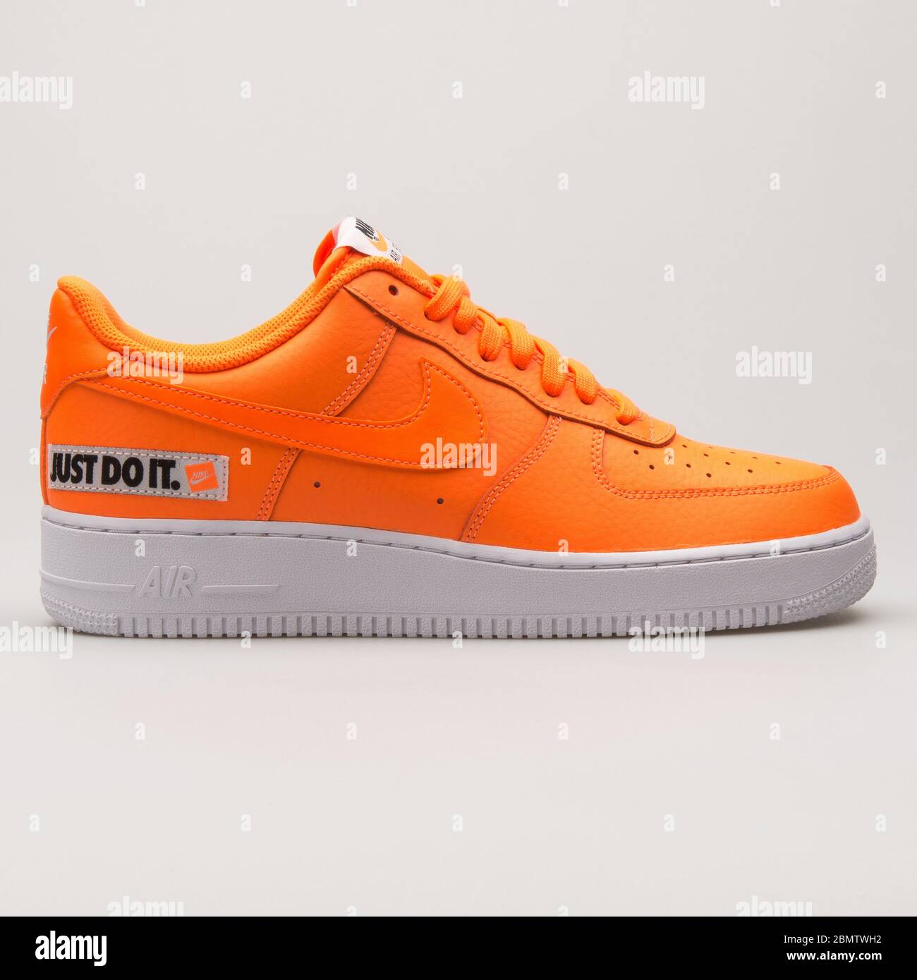 VIENNA, AUSTRIA - JUNE 14, 2018: Nike Air Force 1 07 LV8 JDI Leather orange  and white sneaker on white background Stock Photo - Alamy