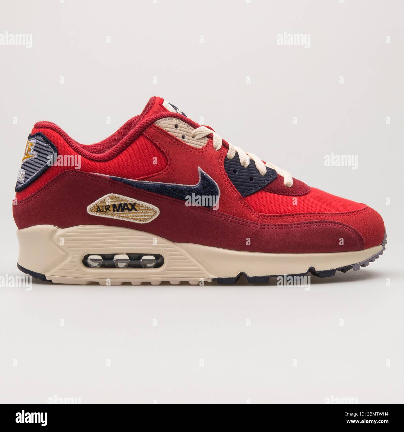VIENNA, AUSTRIA - JUNE 14, 2018: Nike Air Max 90 Premium Suede red, sail  and purple sneaker on white background Stock Photo - Alamy