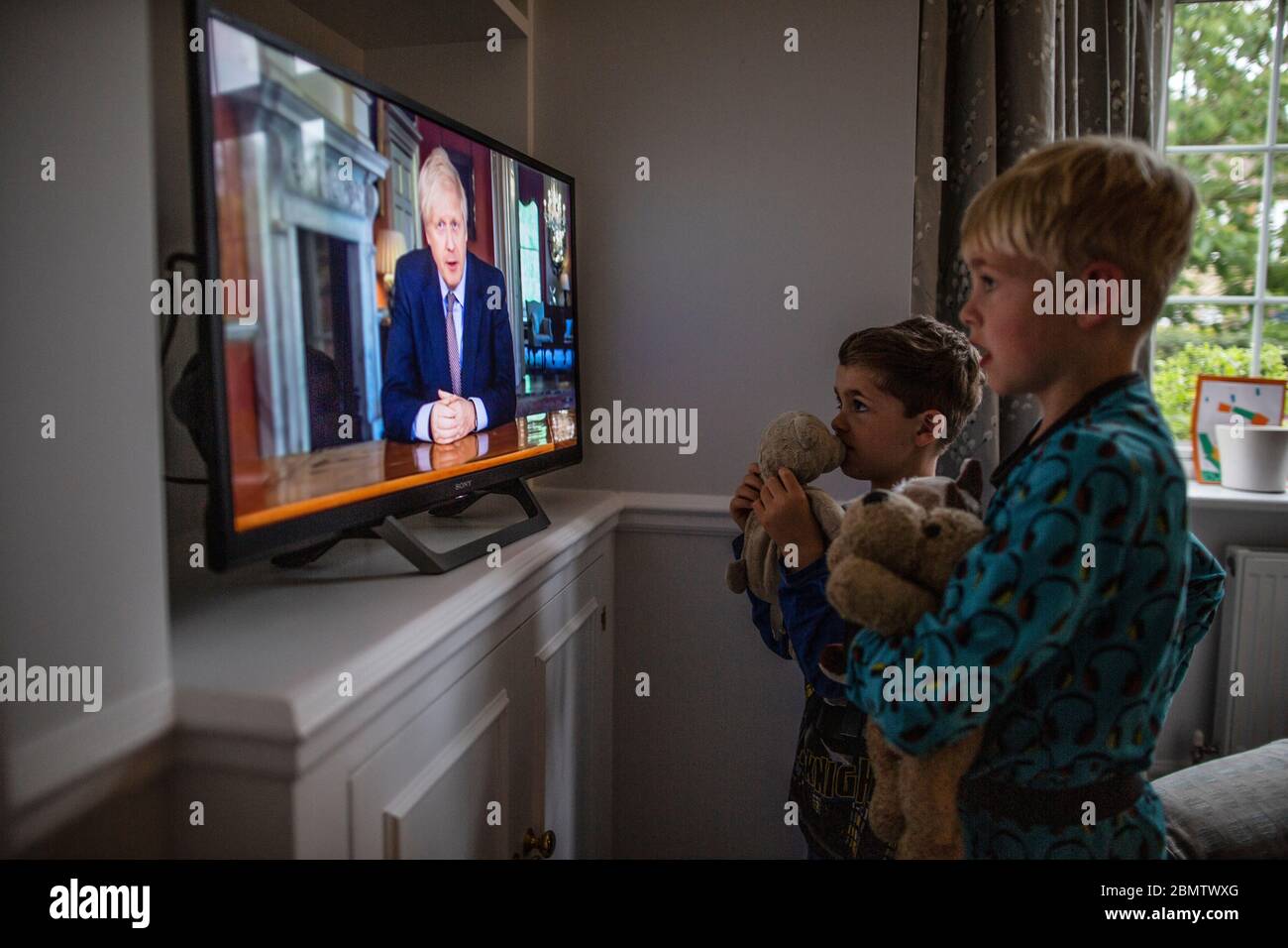 Family watch boris johnson tv address hires stock photography and