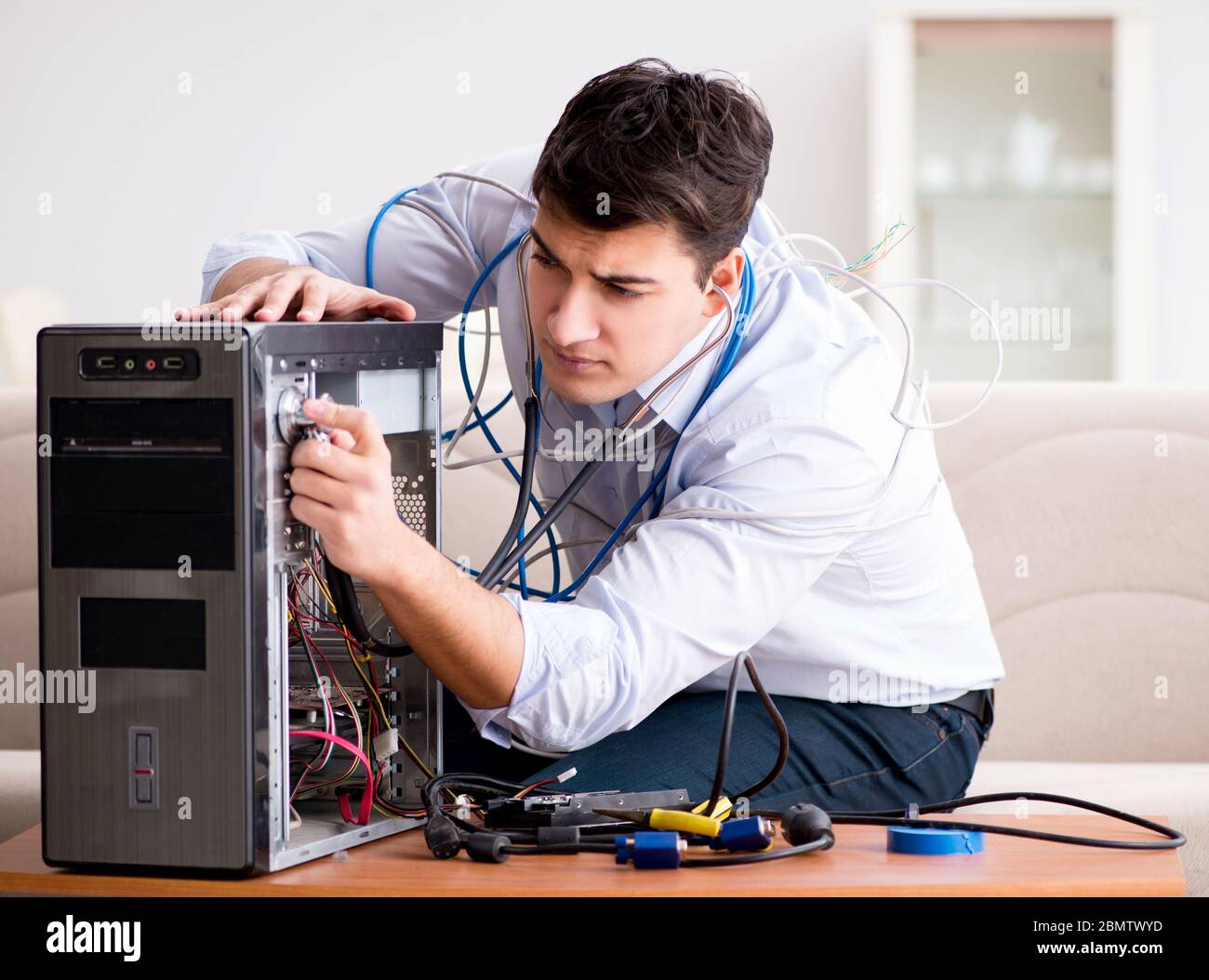 Technician repairing broken pc desktop hi-res stock photography and ...