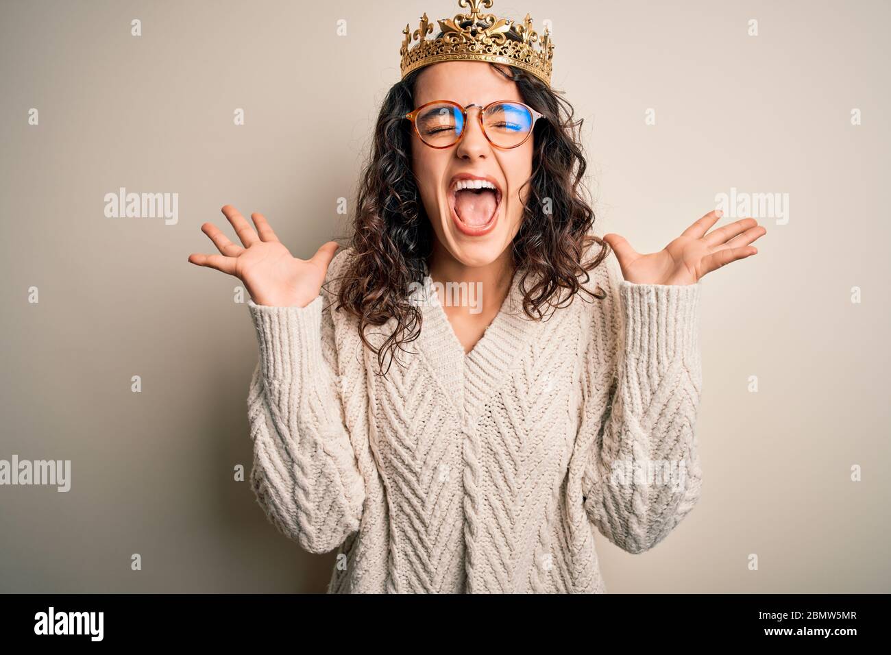 Princess wearing golden crown glasses hi-res stock photography and ...