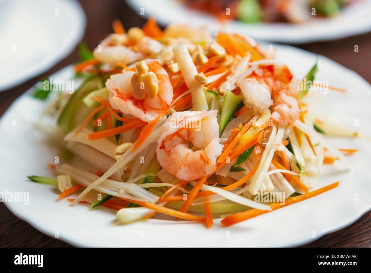 https://c8.alamy.com/comp/2BMW6AK/asian-sea-foodshrimp-salad-with-raw-cabbage-served-on-white-plate-in-vietnamese-restaurantfresh-seafood-for-healthy-eatingdiet-nutrition-and-exotic-2BMW6AK.jpg